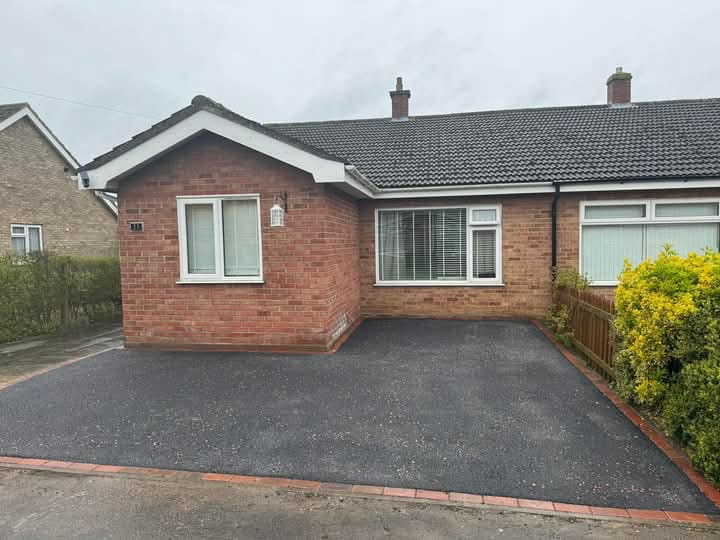 Residential bungalow driveway with brick edging