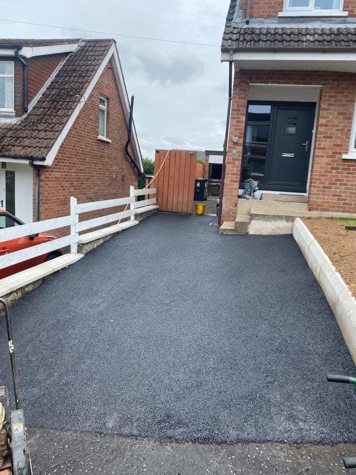 Freshly pressure cleaned tarmac driveway